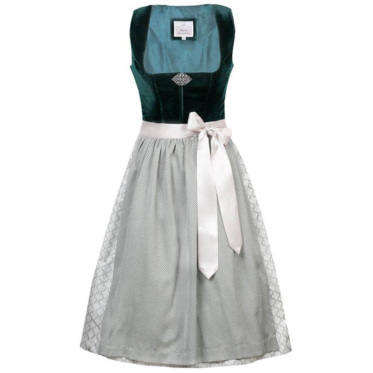 Elegantes Dirndl mit schlichtem Samtmieder in smaragdgrün und Reißverschluss sowie Schließe am Ausschnitt. Der Rock zeigt ein Ornamentenmuster und ist farblich abgestimmt mit der passenden Schürze.