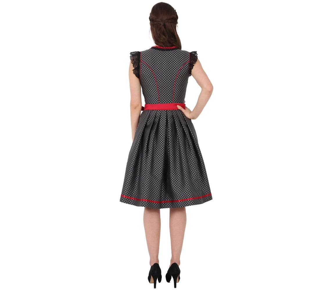 Elegantes Dirndl mit herzförmigem Mieder, mittigem Reißverschluss und passender Schnürung, einheitlichem Muster und Spitzenschürze mit rotem Kontraststoff.