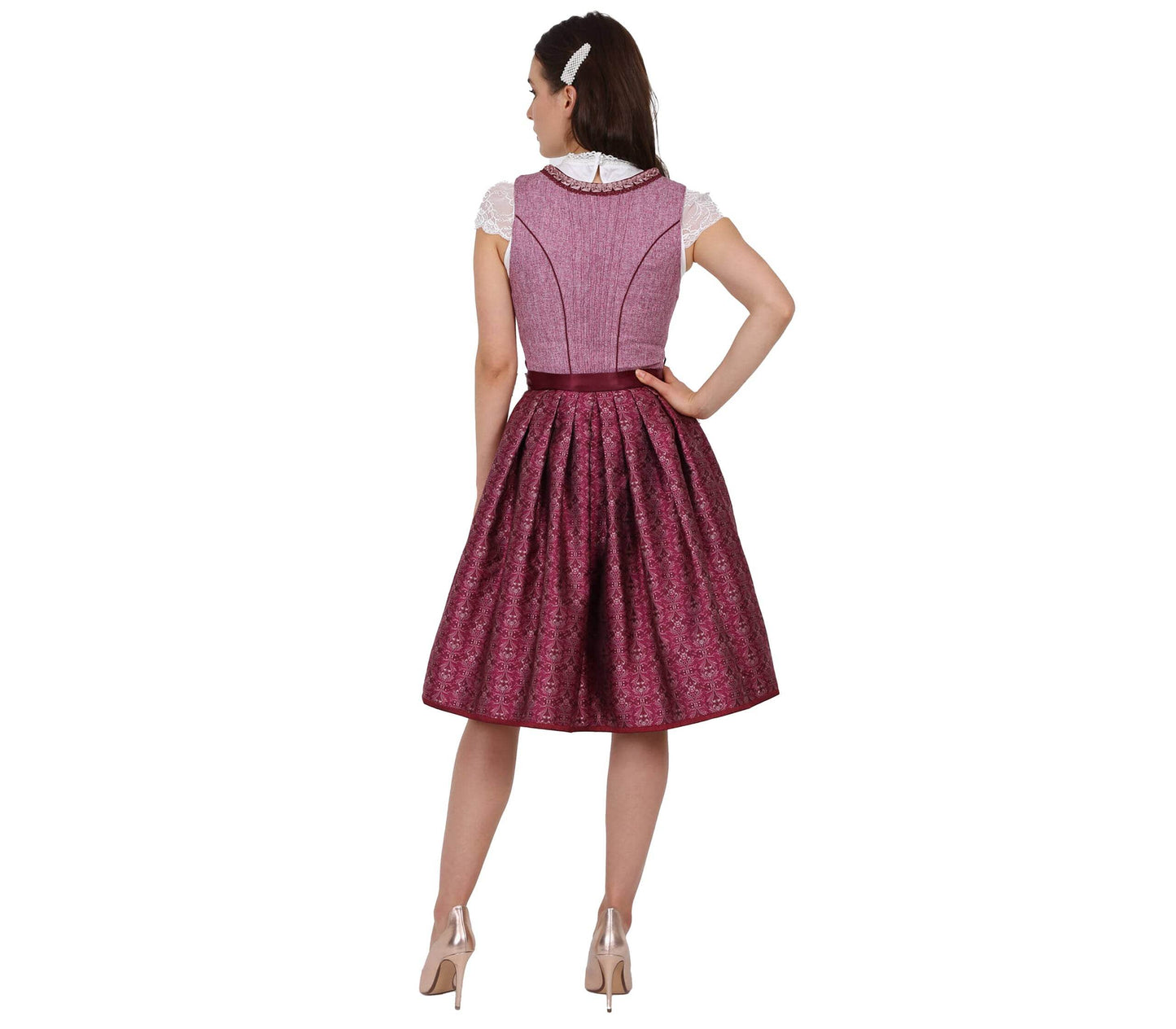 Elegantes pinkes Dirndl mit Mieder ohne Schnürung und mittigem Reißverschluss, Rock mit Ornamentenmuster und reich verzierte Spitzenschürze mit Kontraststoff.