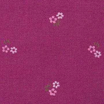 Stoffmuster für Dirndl mit Trachtenstoff in Fuchsia und Weiß mit kleinen Hirschen und Blumen für Erwachsene, kindliches Blümchenmuster in Pink und Grün sowie Schürze mit mehrfarbigem Blümchenjacquard in Weiß, Fuchsia, Blau und Lila.