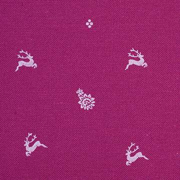 Stoffmuster für Dirndl mit Trachtenstoff in Fuchsia und Weiß mit kleinen Hirschen und Blumen für Erwachsene, kindliches Blümchenmuster in Pink und Grün sowie Schürze mit mehrfarbigem Blümchenjacquard in Weiß, Fuchsia, Blau und Lila.
