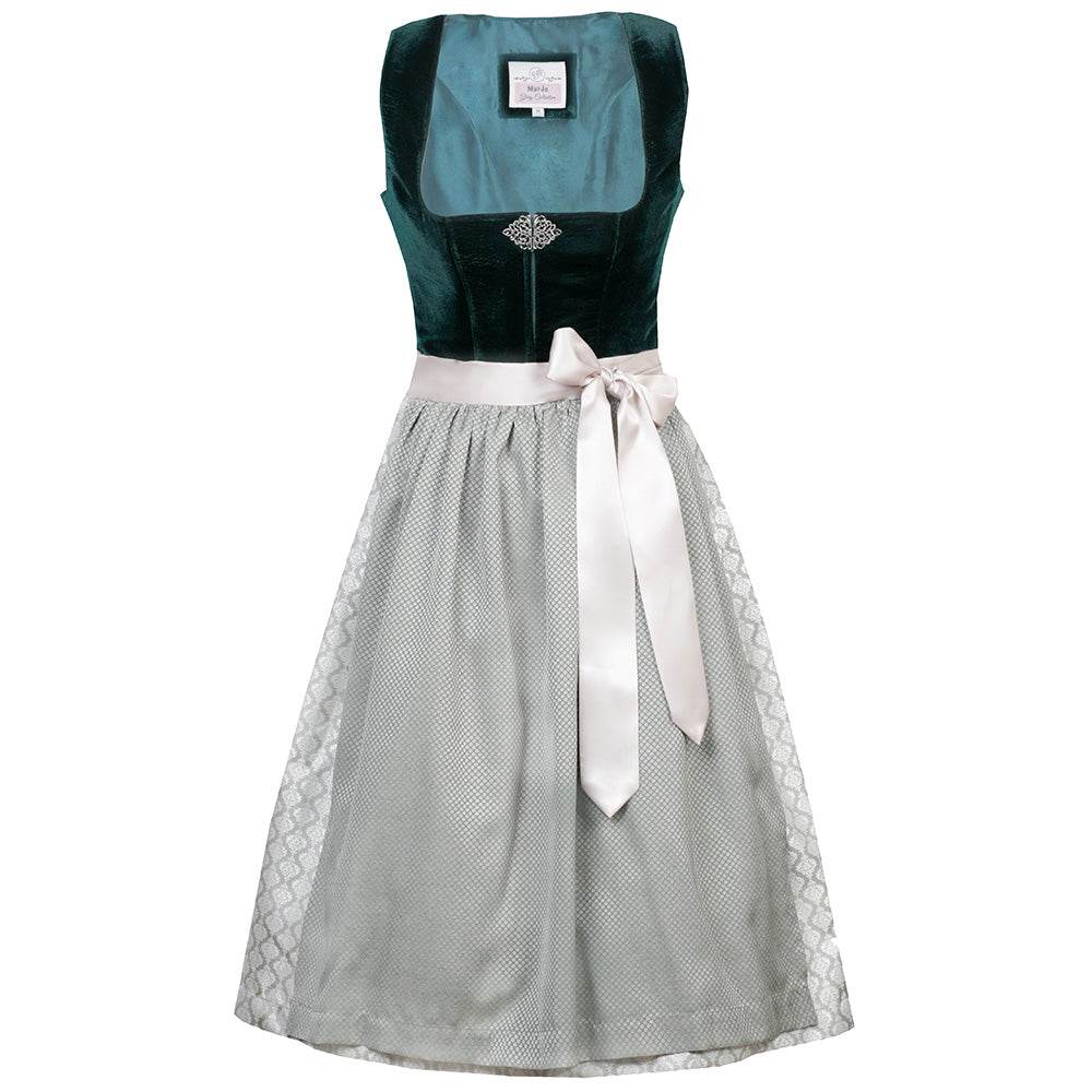 Elegantes Dirndl mit schlichtem Samtmieder in smaragdgrün und Reißverschluss sowie Schließe am Ausschnitt. Der Rock zeigt ein Ornamentenmuster und ist farblich abgestimmt mit der passenden Schürze.
