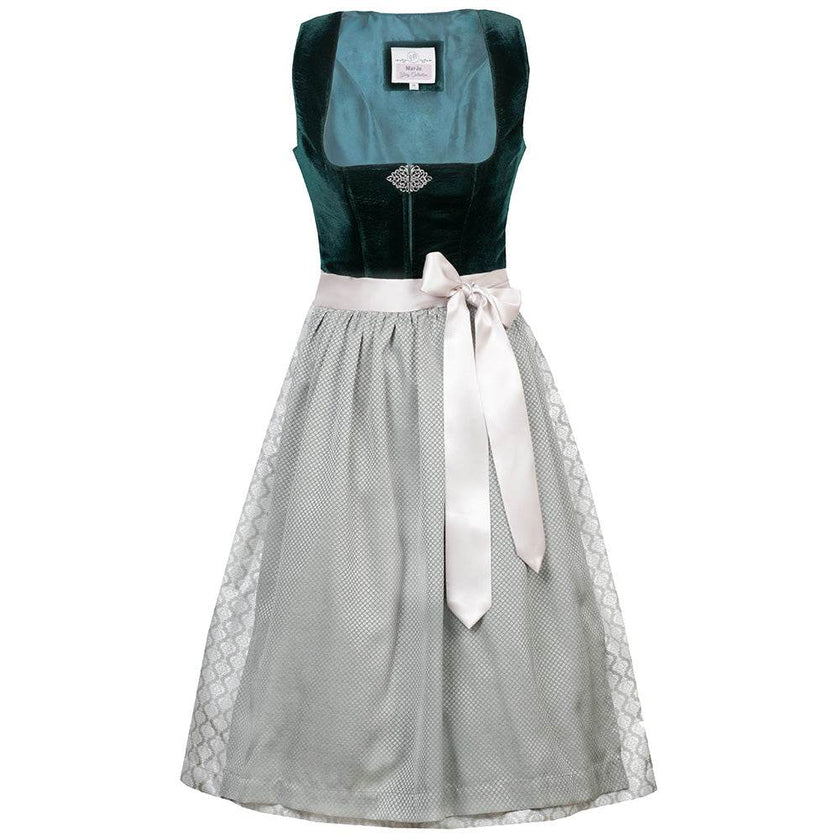 Elegantes Dirndl mit schlichtem Samtmieder in smaragdgrün und Reißverschluss sowie Schließe am Ausschnitt. Der Rock zeigt ein Ornamentenmuster und ist farblich abgestimmt mit der passenden Schürze.
