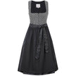 Zweiteiliges Dirndl in schwarz-creme mit Jacquard-Mieder im Rautenmuster, gepaspelten Ausschnitten und Reißverschluss vorne. Schwarzer Rock mit feinem Ornamentmuster, schwarze geraffte Schürze mit perlenverziertem Band und zwei verschließbaren Reißverschlusstaschen.