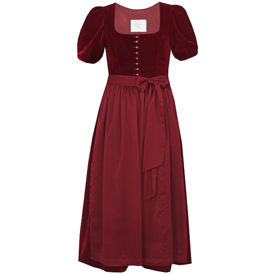Auffälliges rotes Samt-Dirndl mit modernem Mieder, geradem Ausschnitt und Knopfleiste. Die abnehmbare Schürze ist mit einer Schleife gebunden, das Dirndl endet knapp über dem Knie.