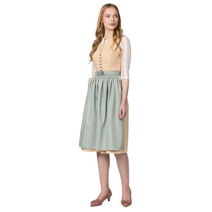 Klassisches gelbes Dirndl mit hochgeschlossenem Schnitt, V-Ausschnitt mit dekorativen Knöpfen, fein gemustertem Stoff und unifarbener Schürze mit Metallschließe.