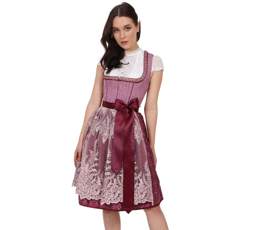 Elegantes pinkes Dirndl mit Mieder ohne Schnürung und mittigem Reißverschluss, Rock mit Ornamentenmuster und reich verzierte Spitzenschürze mit Kontraststoff.